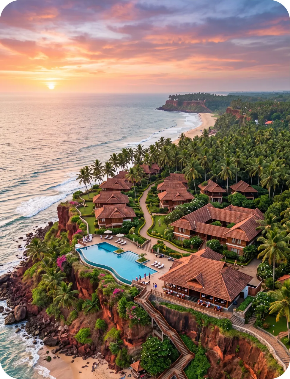 Aerial view of a cliffside beach resort at sunset